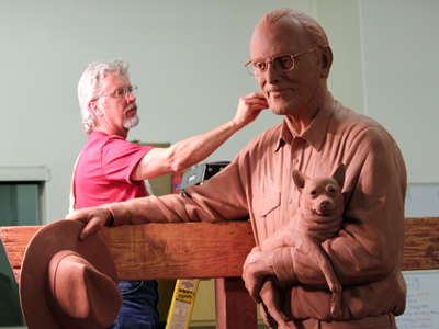 The 18" clay maquette in the foreground (at right) is phase one in developing the eight-foot full-size clay sculpture. Custom portrait bronze monumental western ranch sculpture scene of Bo Rubenstein, Texas Pipe, Frebo Ranch, Columbus, TX, Hwy 71 ,Tom White monumental bronze sculptor, commission bronze portraits, public figurative bronze monuments, Western bronze sculptures, historical monumental bronzes, portrait bronze artist, commission a sculpture, cowboy ranch bronze scenes, longhorn sculptures