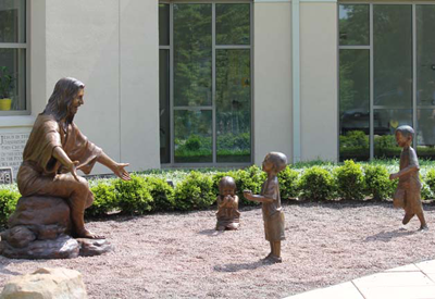 "Christ Our Rock" lifesize monument and tabletop bronze statues by Tom White, Christian Monumental Bronze Sculptor, placed in Tannersville, Pennsylvania and Gatesville, Texas at the Davidson Memorial Prayer Garden Christian sculptures, tabletop Biblical faith-based sculptures, statue of Christ, public monument, statues of Jesus welcoming children, Jesus Christ sculptures, religious monumental bronze sculptures