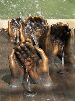 Bronze hands fountain created by bronze portrait artist, Tom White, monumental bronze sculptor, for Dillard family Fort Worth, Texas.  Family heirloom sculpture of hands of father, mother and six kids, custom bronze water fountain featured at home.  Tom specializes in custom commissioned bronze figurative sculptures for memorials, public monuments, family portraits and commemorative bronze