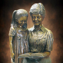 Heritage of Love Custom lifesize bronze sculpture scenes, teacher reading to children bronze, Wilson Public Library, Cozad Nebraska, public monumental portrait bronze statues by Tom White, monumental bronze sculptor, statues of children, bronze monuments, public library sculptures, statues for schools of teachers and children, library statues, sculptures of teachers, commission a sculpture