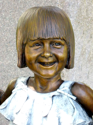 Monumental bronze memorial sculpture of Sami McDonald with statue of Jesus swinging her, Cavehill Cemetery commemorative portrait bronze by Christian Sculptor Tom White.  Children and Jesus sculptures in lifesize and monumental bronze, sculptures of Christ