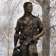 Monumental Vietnam Soldier at Plainview Memorial Veterans Cemetary in Big Piney, WY. Bronze monumental Vietnam War soldier sculpture, Plainview Memorial, Big Piney, WY, Tom White, Monumental life-size bronze statue, Medal of Honor recipient, public war memorials, figurative bronze portrait sculptures of soldiers, military war memorial monuments, portrait sculptures of soldiers, veteran memorials, coast guard statues, army soldier sculptures, air force soldier monuments, army soldier portrait bronzes, bronze monuments of marine soldiers,  figurative portrait bronze memorials of military personnel, life-size bronze statue of a Gold Star Mom, public monumental heroic military bronze commissions, commission a sculpture of a soldier